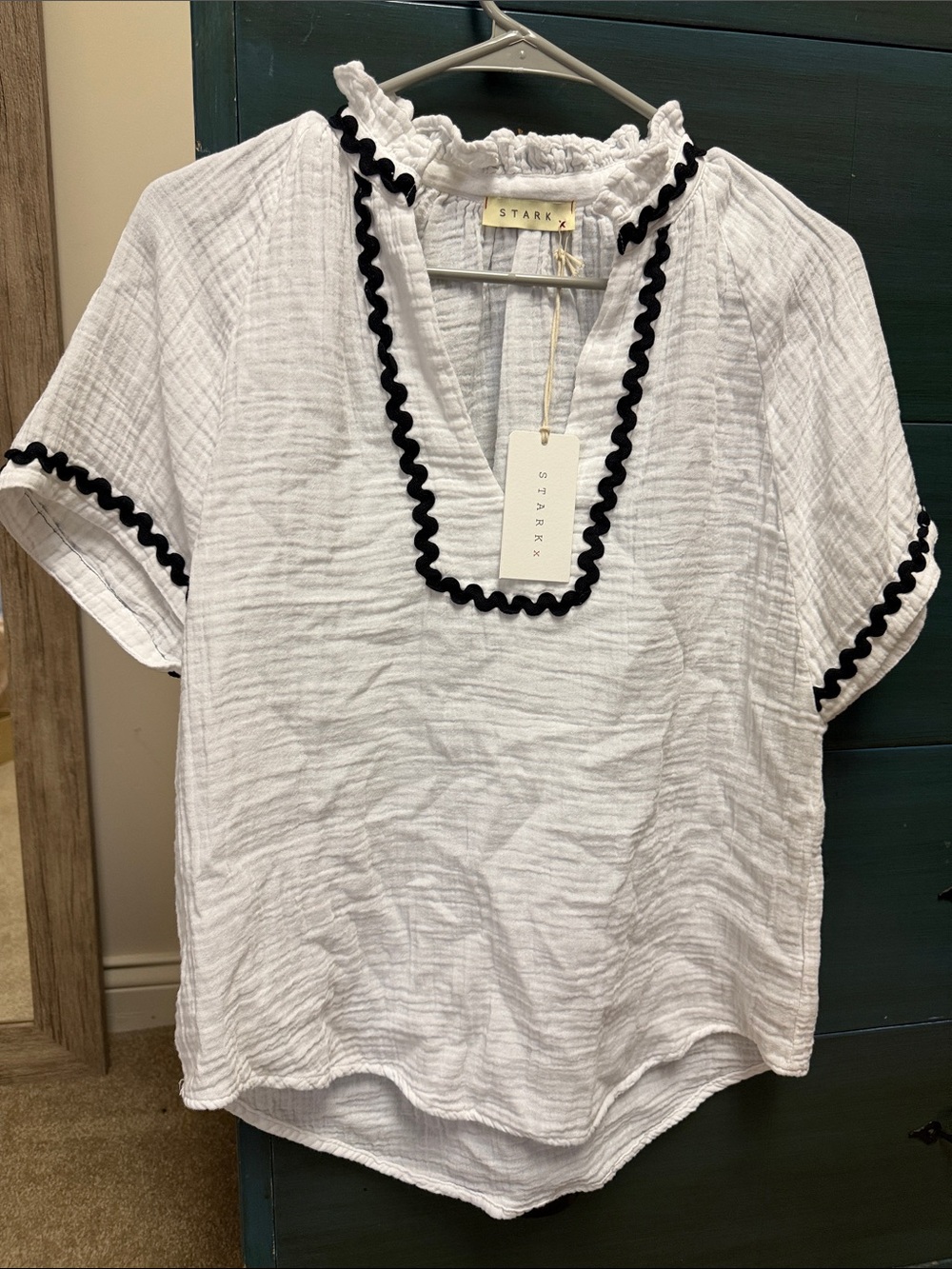 Stark x White Short-Sleeve Ruffle Neck Top with Black Trim